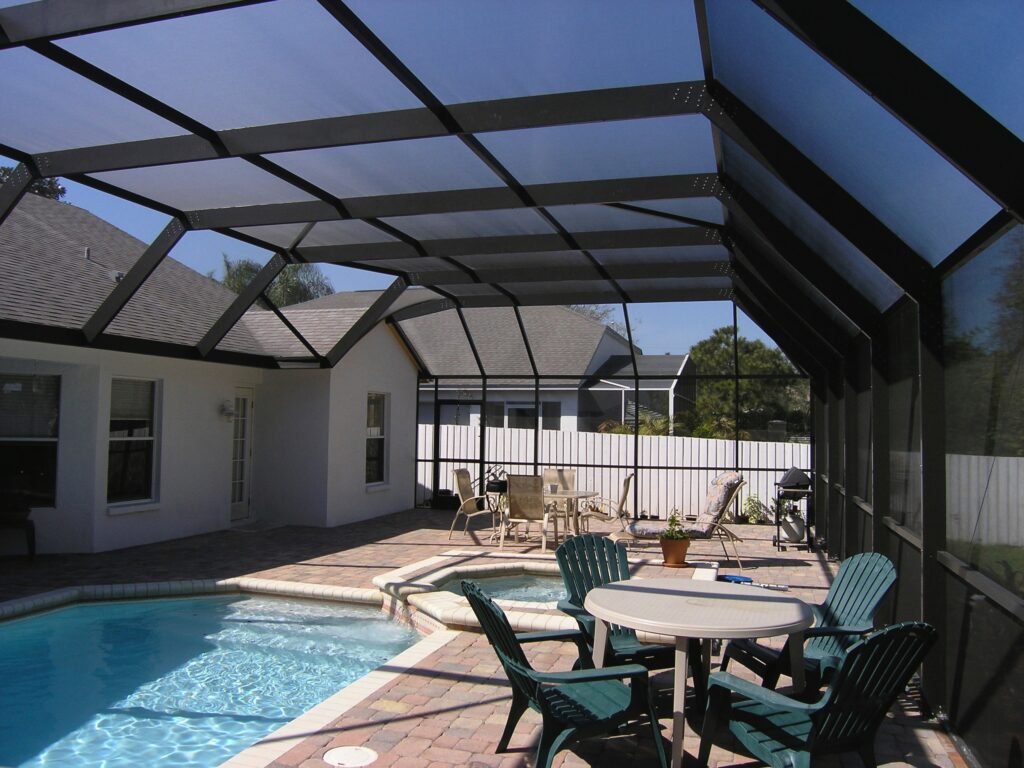 Pool screen enclosure installation in St. Augustine, FL covering backyard patio and pool